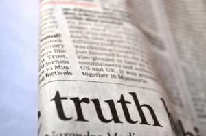 Truth Headline stands out on the front page of a newspaper